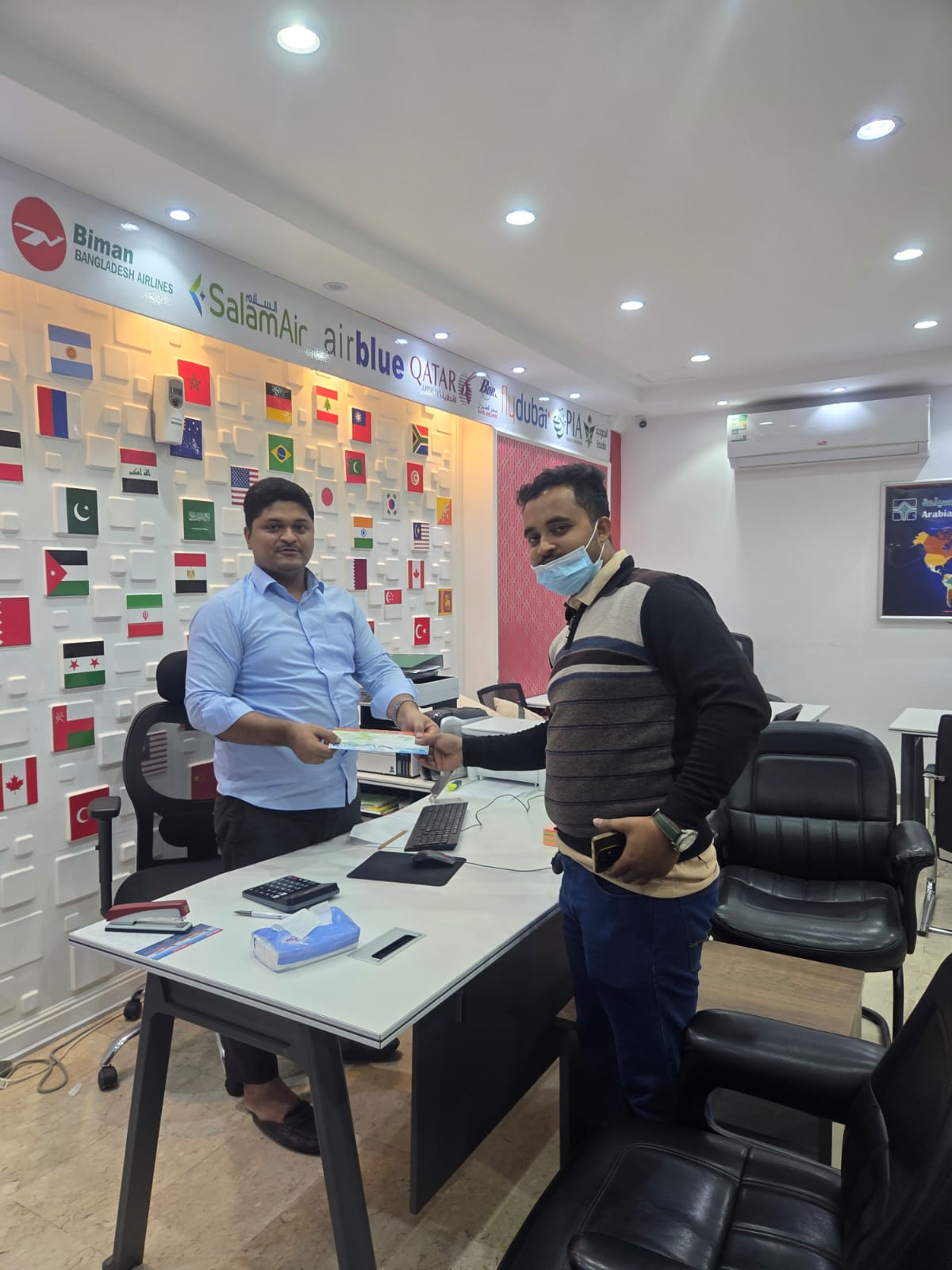 Customer being served inside the Nagm Al-Arbia office